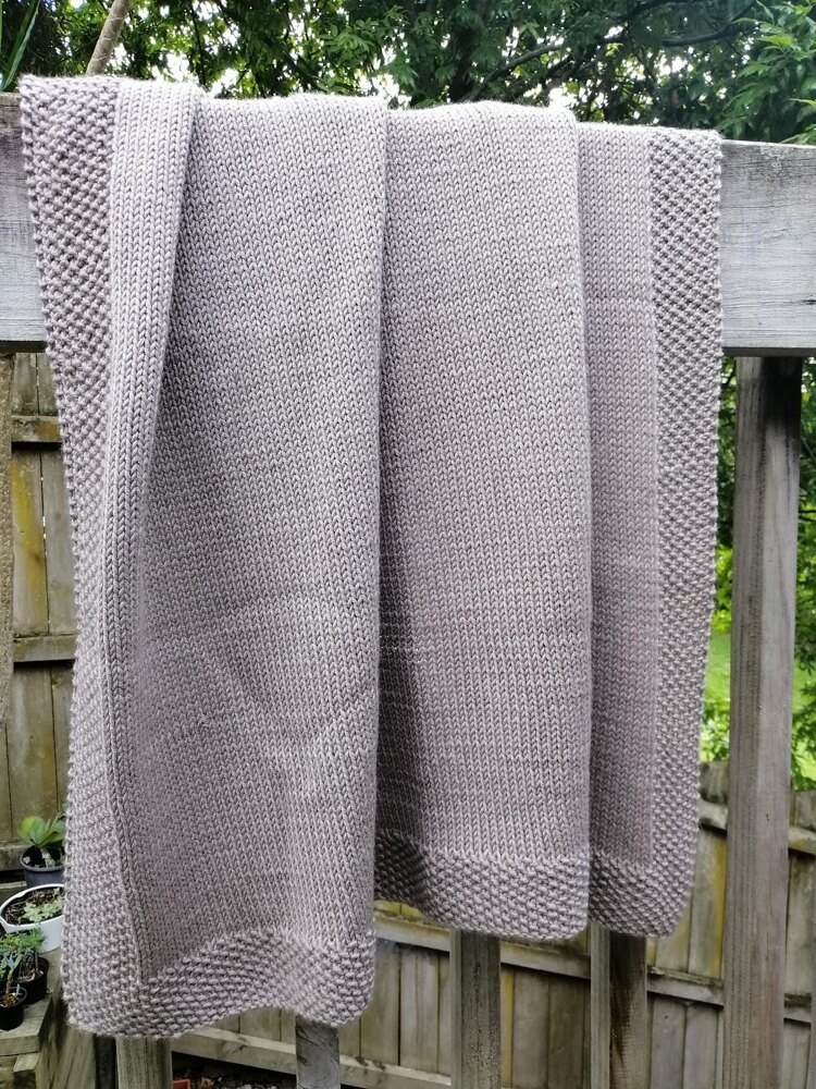 Easy Stockinette Baby Blanket Knitting Pattern with Seed Stitch Border