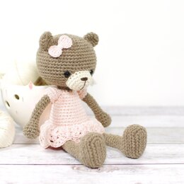 Long-legged teddy bear in a dress